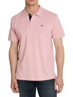 Polo en coton rose uni pourvu d'un col boutonné et de manches courtes