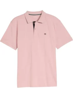Polo en coton rose uni pourvu d'un col boutonné et de manches courtes