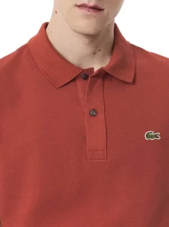 Polo en coton rouge brique uni à coupe slim fit avec le logo à la poitrine