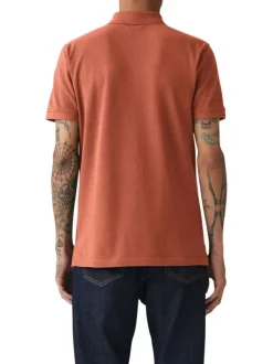 Polo en coton rouille en maille piquée à coupe droite avec des manches courtes