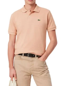 Polo en coton saumon uni avec une coupe regular fit et le petit crocodile brodé