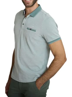 Polo en coton vert uni avec une coupe droite et une poche passepoilée à l'avant