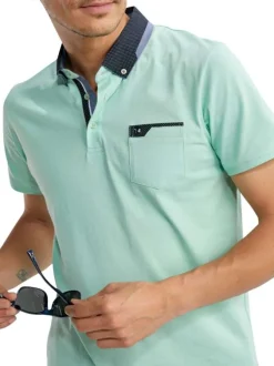 Polo en coton vert uni pourvu de manches courtes et d'un col américain