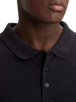 Polo en maille piquée de coton noir uni à col boutonné et Batwing poitrine
