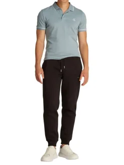Polo à manches courtes en coton bleu uni à coupe ajustée avec des liserés blancs