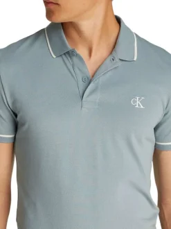 Polo à manches courtes en coton bleu uni à coupe ajustée avec des liserés blancs