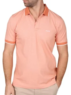 Polo manches courtes rose uni avec une coupe droite et un col à revers