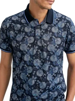 Polo marine floral pourvu de manches courtes et d'un col boutonné