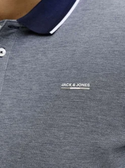 Polo marine uni avec une coupe droite et un col boutonné à manches courtes