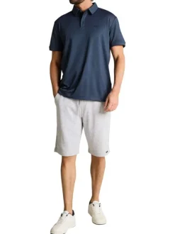 Polo marine uni pourvu de manches courtes et d'un col boutonné