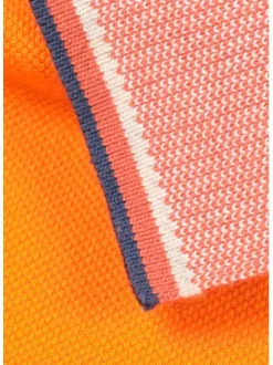 Polo orange en coton maille piquée avec nombreux détails coupe droite col boutonné