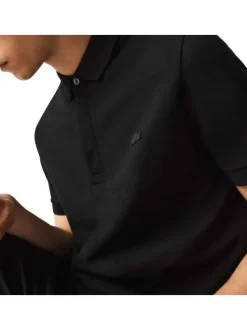 Polo Paris en coton noir uni coupe droite col boutonné et manches resserrées