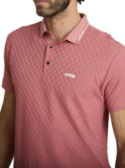 Polo rose à coupe droite pourvu d'un col boutonné et de manches courtes
