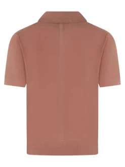 Polo rose uni en coton avec une coupe droite et un col à rabats