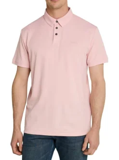 Polo rose uni pourvu de manches courtes et d'un col boutonné