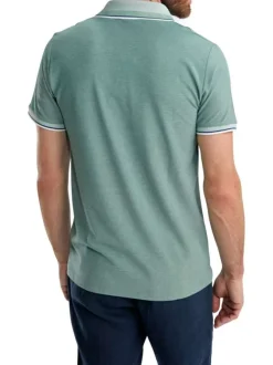 Polo vert uni pourvu de manches courtes et d'un col boutonné
