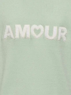 Pull vert d'eau uni pourvu de manches longues et d'une coupe droite