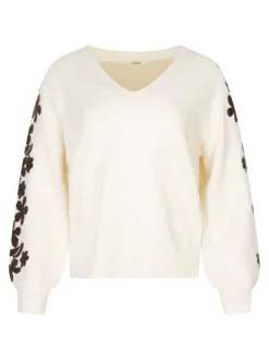 Pull beige brodé avec un col v et des manches longues