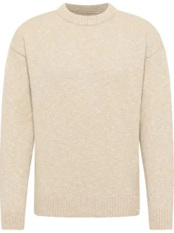 Pull beige uni en maille tricotée avec un col rond et des manches longues