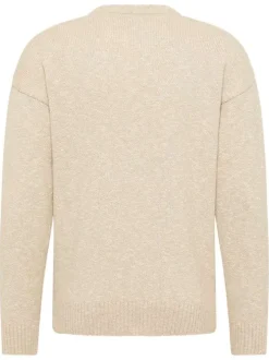 Pull beige uni en maille tricotée avec un col rond et des manches longues
