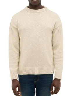 Pull beige uni en maille tricotée avec un col rond et des manches longues