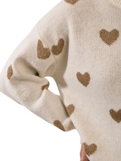 Pull blanc à motifs coeurs avec une coupe droite et un col rond