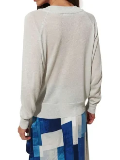 Pull blanc pailleté à coupe droite avec un col v et des manches longues