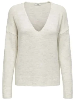 Pull blanc uni avec une coupe droite et des manches longues