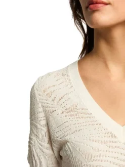 Pull blanc uni à coupe ajustée, col v et à manches courtes et motifs végétaux