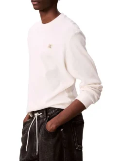 Pull blanc uni texturé avec un petit patch brodé et à col rond