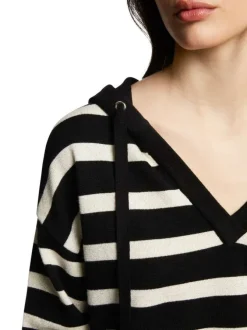 Pull à capuche rayé noir et blanc à coupe ample avec col v et manches longues