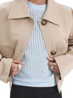 Pull ciel uni pourvu d'une coupe droite et de manches courtes