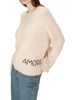 Pull écru en maille fine avec une coupe ample et un col rond