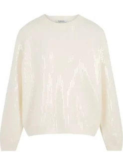 Pull écru parés de sequins brillants et pourvu d'un col rond