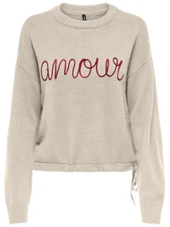 Pull écru uni avec un col rond et une coupe droite et des manches longues