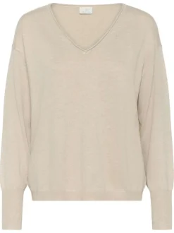 Pull écru uni pourvu d'une coupe droite et de manches longues