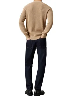 Pull en coton beige uni avec une coupe droite et nom iconique