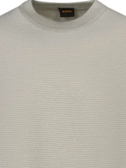 Pull en coton beige uni avec une coupe droite et un col rond