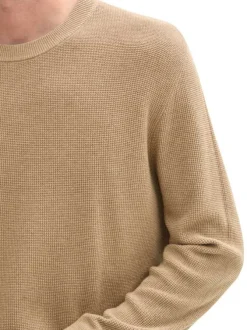 Pull en coton beige uni en maille serrée avec une coupe droite et un col rond