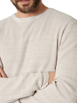 Pull en coton beige uni pourvu d'une coupe droite et d'un col rond
