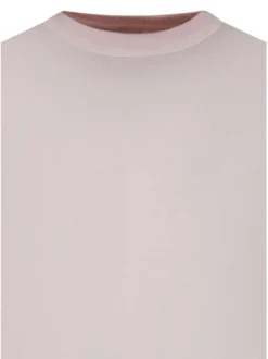 Pull en coton biologique rose uni pourvu d'un col rond et d'un aspect fumé