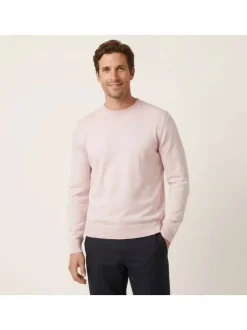 Pull en coton biologique rose uni pourvu d'un col rond et d'un aspect fumé