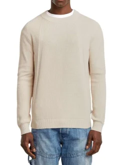 Pull en coton blanc uni avec une coupe droite et un col rond
