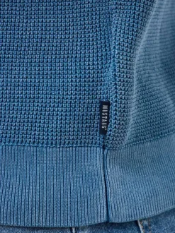 Pull en coton bleu uni avec une coupe droite et un col rond