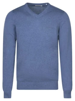 Pull en coton bleu uni coupe ajustée avec un logo en relief sur la poitrine