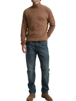 Pull en coton brun uni avec un col roulé et des manches longues