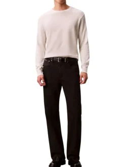 Pull en coton écru uni avec un col rond et des manches longues