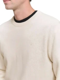 Pull en coton écru uni avec un col rond et des manches longues