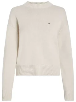 Pull en coton écru uni en maille avec une coupe droite et un col rond