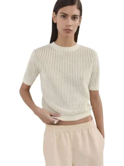 Pull en coton écru uni pourvu d'une coupe droite et d'un col rond